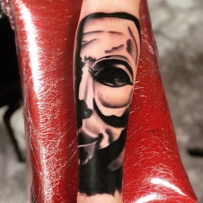 Black and grey realism Guy Fawkes V for Vendetta mask tattoo on the forearm