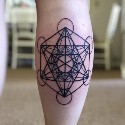 Blackwork sacred geometry Metatron cube tattoo on the calf