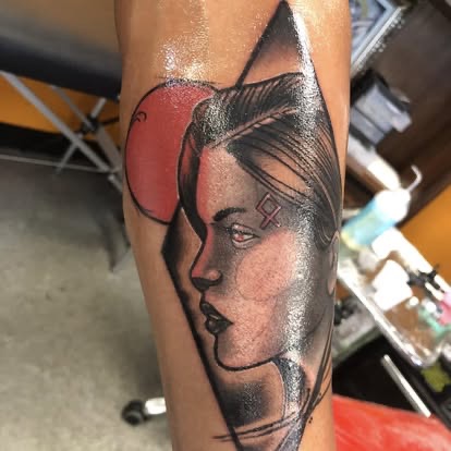 Sketch-style blackwork woman portrait tattoo with a red balloon on the forearm