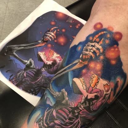 Color new-school flaming skeleton with glowing embers tattoo on the leg