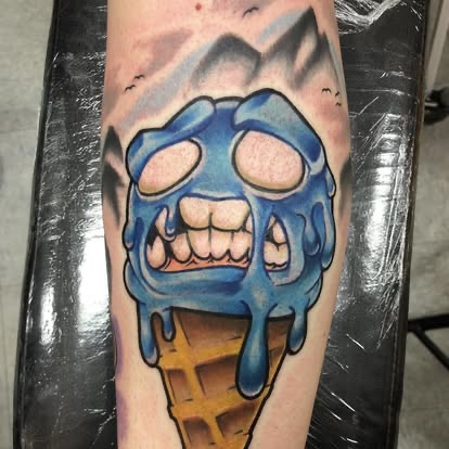 New-school color melting blue ice cream cone skull tattoo on the leg